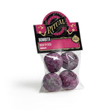 Packaged purple bath bombs with 'Ritual' branding on a white background