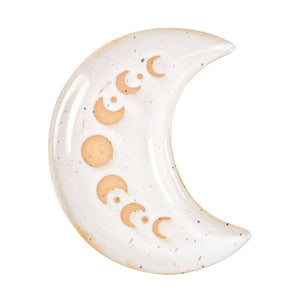 Ceramic moon-shaped decorative item with gold accents on a white background