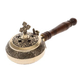 Decorative metal object with wooden handle on a white background
