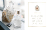 Crystal and perfume bottle on a windowsill with text about crystal care.