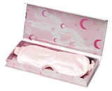 Pink sleep mask in a decorative box with cloud and moon designs.
