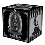 Box packaging for a skeleton figurine with decorative design elements.