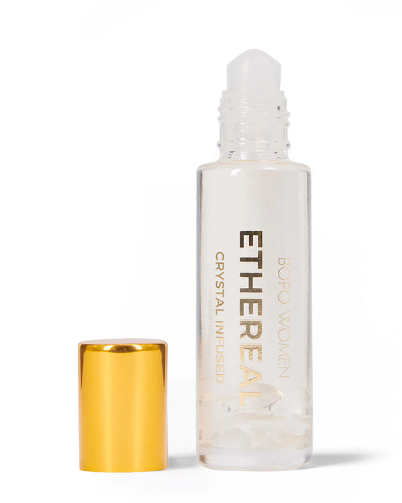 Ethereal rollerball bottle with gold cap on a white background