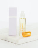 Ethereal skincare product with gold cap on a white background
