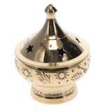 Gold incense burner with star and sun designs on a white background