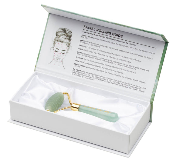 Facial roller with green jade ball in a white box with instructions