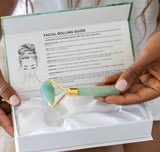 Facial roller with guide in a box held by hands