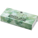 Green jade facial roller packaging on a white background