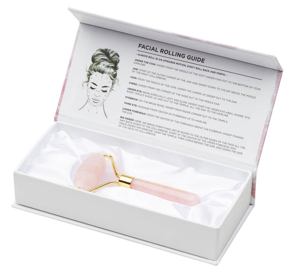 Facial rolling tool in a white box with a guide on a white background
