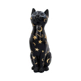 Black cat figurine with gold stars and moons on a white background