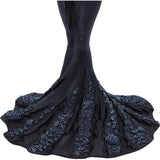 Black embroidered dress with floral details on a white background