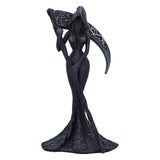 Black decorative figurine with intricate designs on a white background