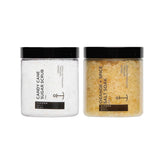 Two jars of 'Candy Cane Sugar Scrub' and 'Orange + Spice Salt Soak' on a white background