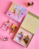 Perfume bottles and packaging on a pink background