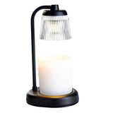 Table lamp with a black base and clear glass shade on a white background