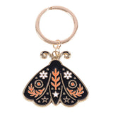 Keychain with moth design on a white background