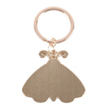 Gold keychain with a unique design on a white background