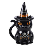 Black cat mug with witch hat on a white background