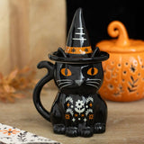 Black cat mug with witch hat and pumpkin in the background