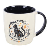 Mug with a black cat design on a white background