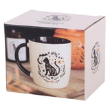 White mug with black cat design in a decorative box