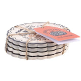 Set of coasters tied with string on a white background
