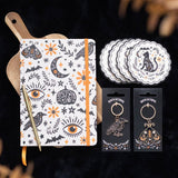 Notebook with decorative design, keychains, and coasters on a dark background