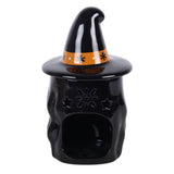 Black ceramic oil burner shaped like a witch's hat with star designs on a white background