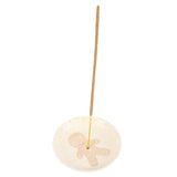 Incense holder with a gingerbread man design on a white background