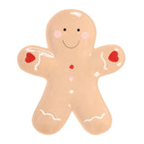 Gingerbread man-shaped cookie with red buttons on a white background