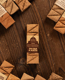 Tribe Earth chocolate bar packaging on a wooden surface with other chocolate bars.