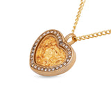 Gold heart-shaped pendant necklace on a white background