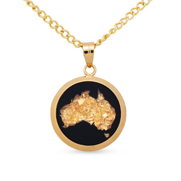 Gold necklace with a pendant shaped like Australia on a white background