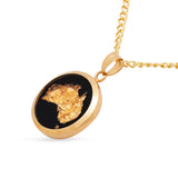 Gold necklace with a pendant featuring a map of Africa on a white background