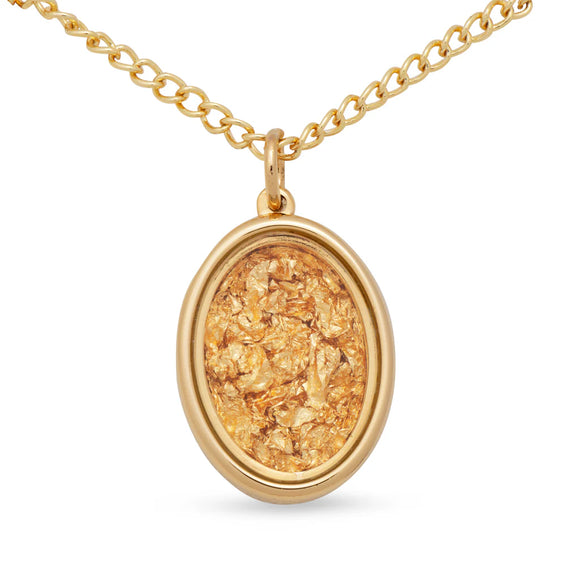 Gold necklace with an oval pendant on a white background