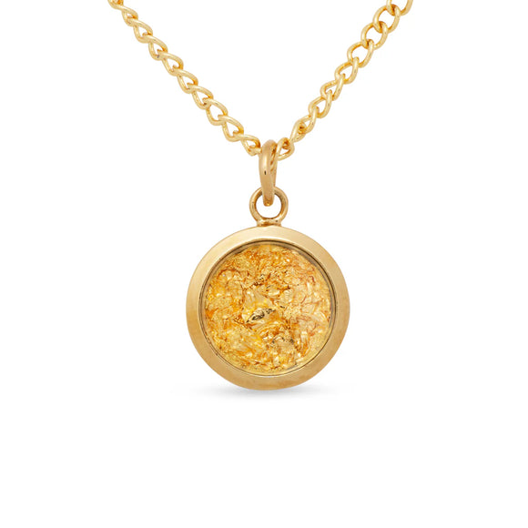 Gold necklace with a round pendant on a white background
