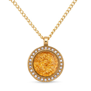 Gold necklace with a round pendant on a white background
