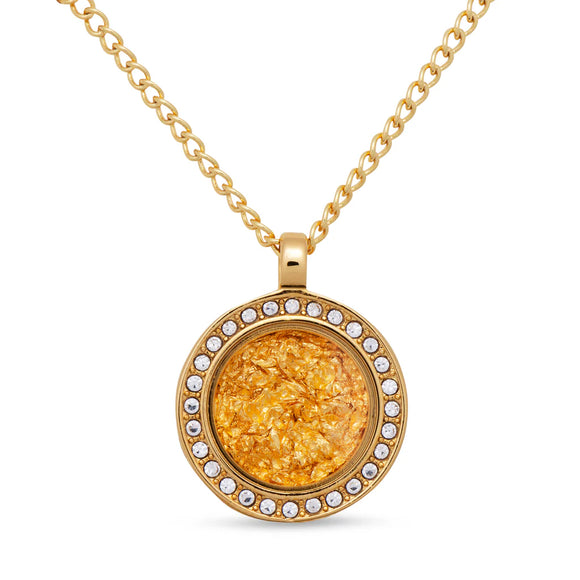 Gold necklace with a round pendant on a white background