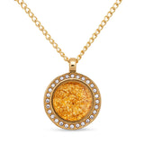 Gold necklace with a round pendant on a white background