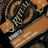 Close-up of a 'Ritual' product label with decorative elements and text.