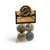 Packaged product with 'Ritual' branding and four spherical items inside on a white background