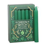 Green Witch spell candles in a decorative box on a white background