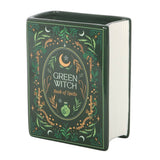 Green witch themed book of spells with decorative cover on a white background