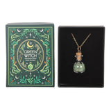Green Witch necklace in a bottle with packaging on a white background
