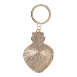 Gold keychain with a unique design on a white background