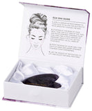 Gua sha tool in a white box with instructions on a white background