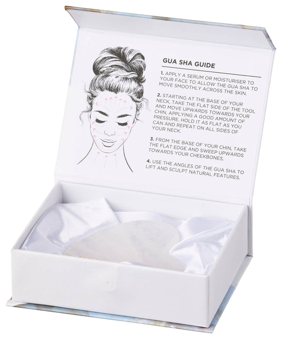 Gua Sha tool set with instructions in a white box