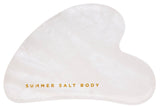 White heart-shaped product with 'Summer Salt Body' text on a white background