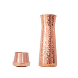 A hammered copper mukut cocktail holder with its matching lid off, displayed on a clean white background.