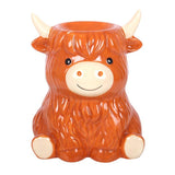 Ceramic cow-shaped container with a white background